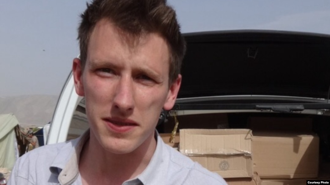 FILE - Abdul-Rahman (Peter) Kassig, an American aid worker, is seen making a food delivery to refugees in Lebanon’s Bekaa Valley, May 2013. (Courtesy of Kassig family)