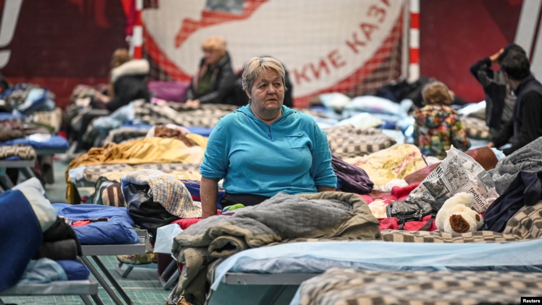 FILE - Residents of the Ukrainian city of Mariupol stay at a temporary accommodation center for evacuees in a local school in Taganrog in the Rostov region, Russia, March 23, 2022. 