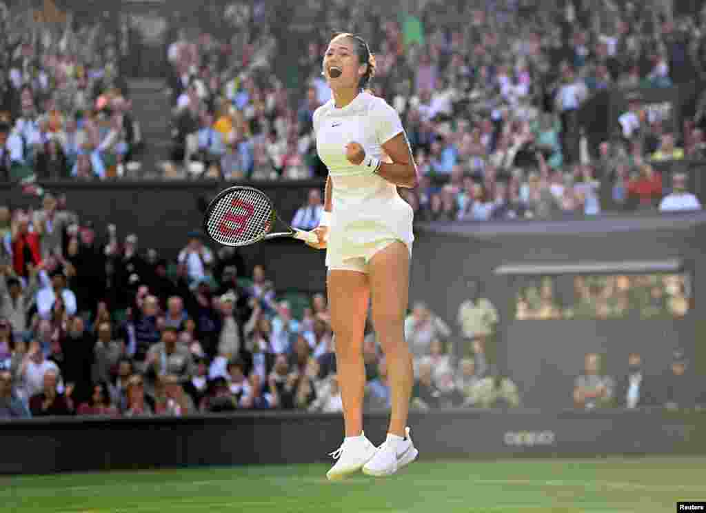 Britain's Emma Raducanu celebrates winning her first-round match against Belgium's Alison Van Uytvanck during the Wimbledon Tennis Championships at The All England Tennis Club in Wimbledon, England, June 27, 2022.