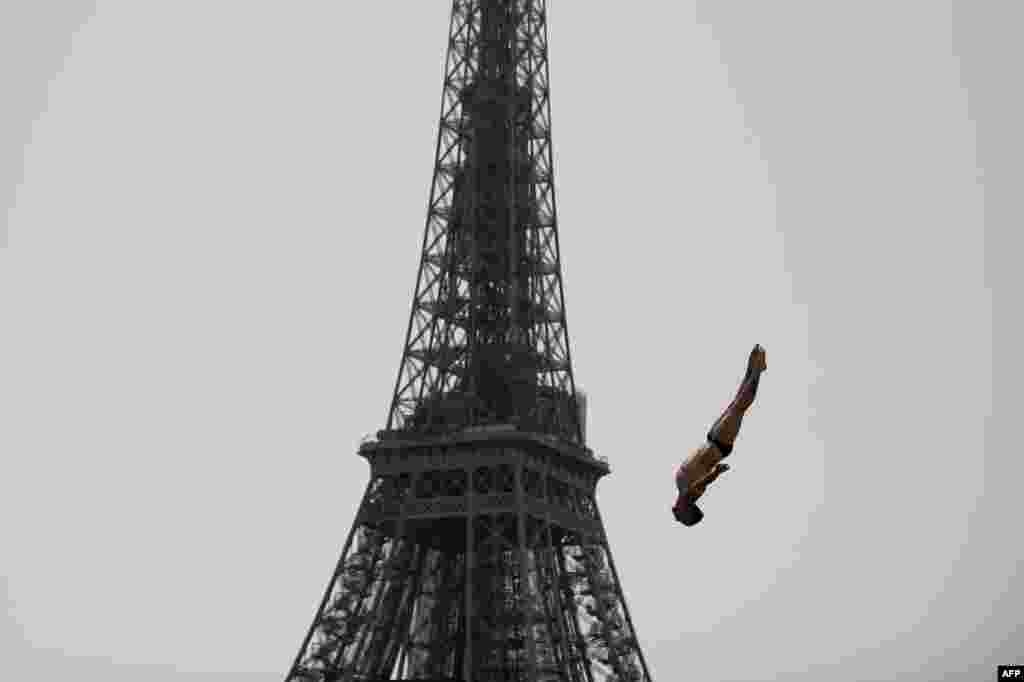 Gary Hunt of France takes a practice dive during the Red Bull Cliff Diving World Series near the Eiffel Tower in Paris, June 18, 2022.