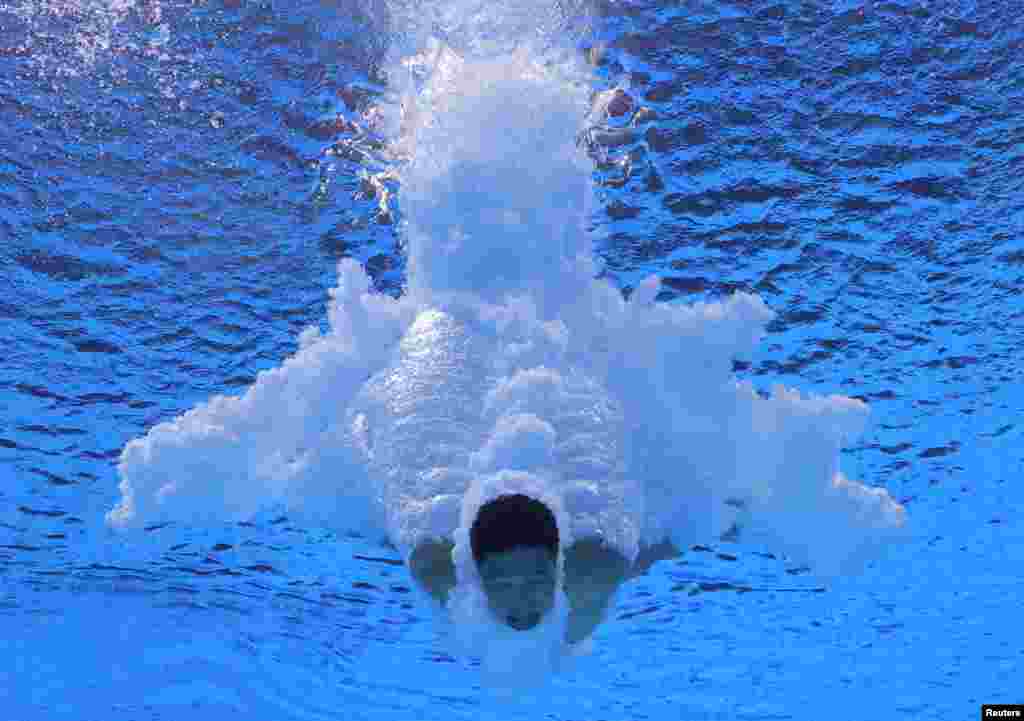 Jian Yang of China competes in the men's 10m platform diving final during the FINA World Championships at the Duna Arena in Budapest, Hungary.