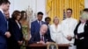 President Joe Biden signs an executive order at an event to celebrate Pride Month in the East Room of the White House, Wednesday, June 15, 2022, in Washington.