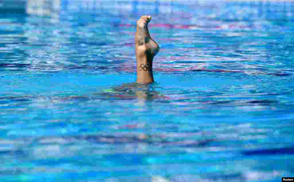 A tattoo showing the Olympic rings is pictured on the leg of Mexico's Joana Jimenez Garcia during the Women Solo Technical Preliminaries, at the FINA World Championships, in Budapest, Hungary.