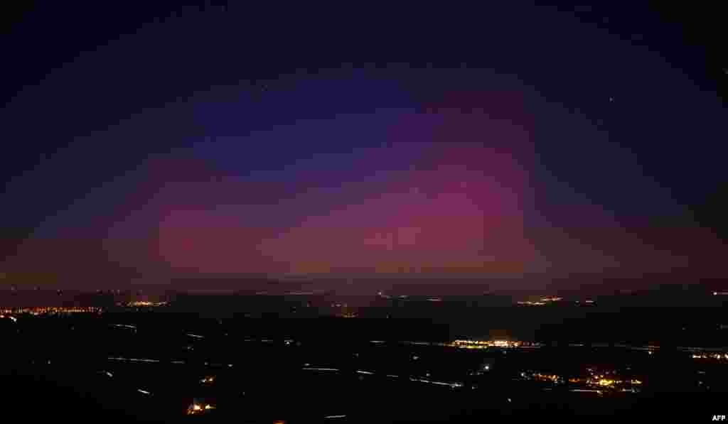 This picture taken from the southeastern France village of La Roquebrussanne shows an aurora borealis early on Jan. 1, 2025.