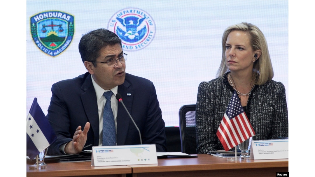 Honduran President Juan Orlando Hernandez speaks beside U.S. Secretary of Homeland Security Kirstjen Nielsen during a multilateral meeting at the Honduran Ministry of Security in Tegucigalpa, Honduras, March 27, 2019.