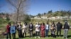 A crowd of dozens of Asian American communities gathers to raise awareness about the increase in hate crimes against Asians in the US near Chinatown Los Angeles, CA. 