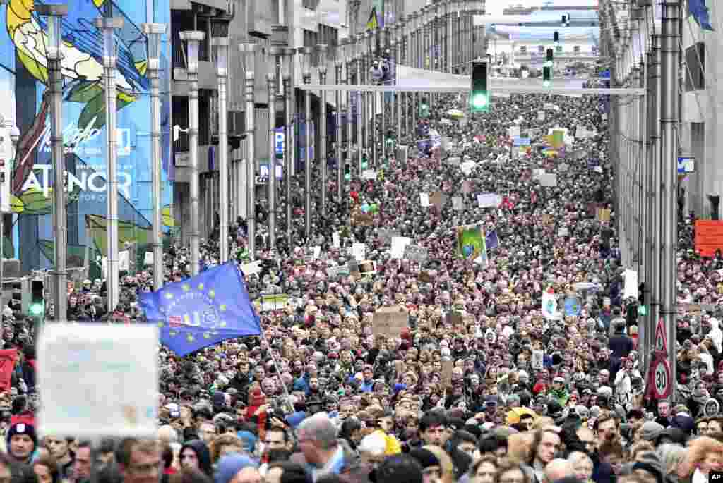 Demonstrators march in the main EU quarter during a 'Claim the Climate' march in Brussels, Belgium. The climate change conference, COP24, will take place in Poland from Dec. 2-14.