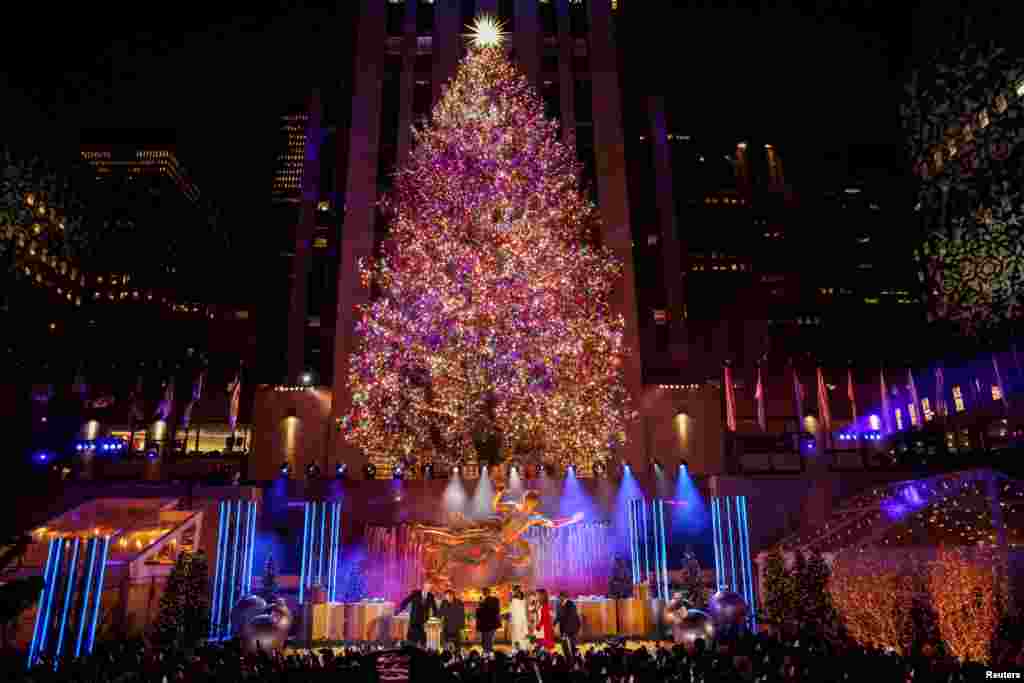People watch the 89th lighting of the The Rockefeller Center Christmas Tree in New York City, Dec. 1, 2021.