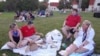 Anne Hooper and her family enjoy a picnic while waiting for fireworks to begin June 27, 2020, at Mount Vernon in Alexandria, Virginia, the historic home of America’s first president, George Washington. (Deborah Block/VOA)