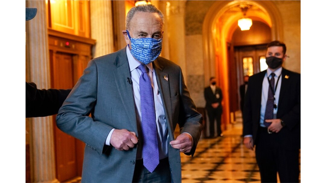 Senate Majority Leader Chuck Schumer of N.Y., heads to an interview on Capitol Hill in Washington, Monday, Jan. 25, 2021.