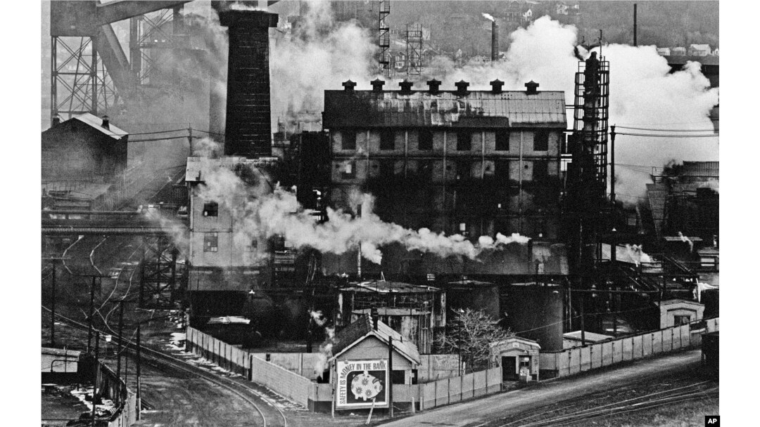FILE – In this September 1980 file photo, a Jones and Laughlin Steel Corp. coke plant is wreathed in smoke and steam in Struthers, Ohio.