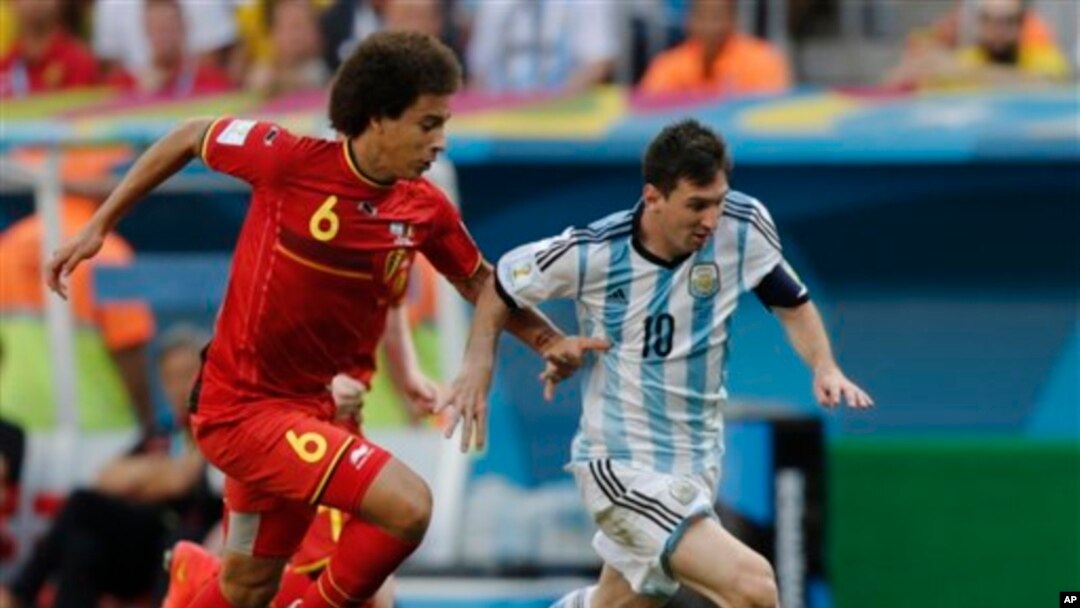Argentina's Lionel Messi controls the ball past Belgium's Axel Witsel during the World Cup quarterfinal soccer match between Argentina and Belgium at the Estadio Nacional in Brasilia, Brazil, Saturday, July 5, 2014. (AP Photo/Eraldo Peres)