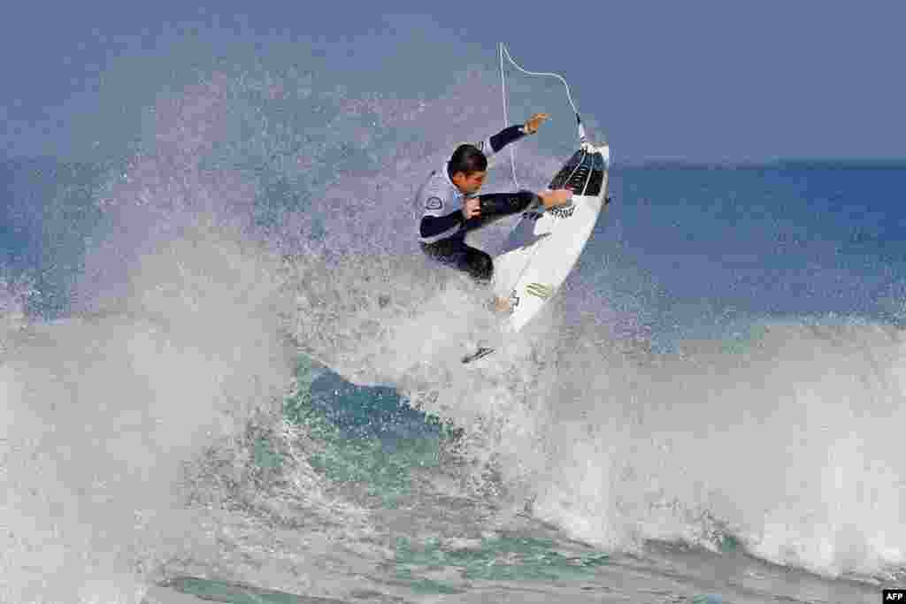 Surfer Luis Diaz of the Canary Island rides a wave during the Men's QS 3,000 of the World Surf League SEAT Pro Netanya qualification, in the Israeli coastal city of Netanya.
