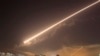 Damascus skies erupt with surface to air missile fire as the U.S. launches an attack on Syria targeting different parts of the Syrian capital Damascus, Syria, early Saturday, April 14, 2018.