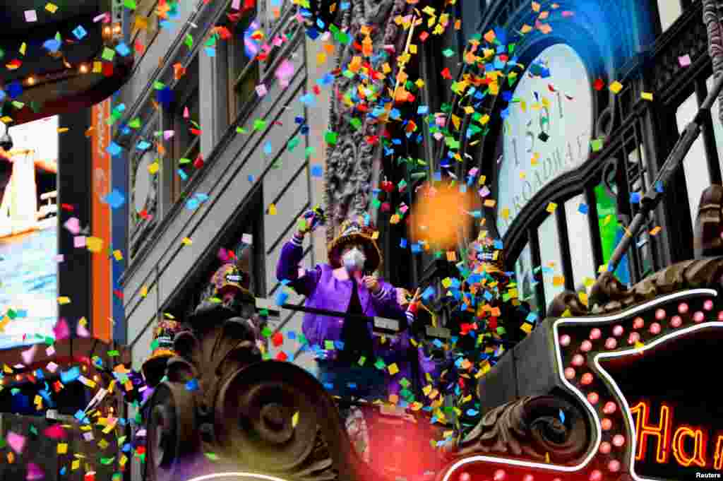 People watch as New Year's Eve confetti is 'flight-tested' ahead of celebrations in the Manhattan borough of New York, Dec. 29, 2021.
