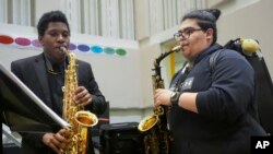Courtney Brunson, left, and Steevan Galindo play saxophones during a rehearsal at Stax Music Academy, Jan. 30, 2025, in Memphis, Tenn. 