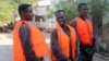 Suspected pirates involved in the attempted hijacking in April of the OS35, a Tuvalu-flagged cargo ship, are seen after Chinese navy officers handed them over to the Somali authorities in the city of Bosaso.