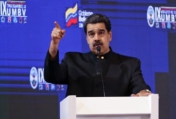 Handout picture released by the Venezuelan Presidency shows Venezuelan President Nicolas Maduro speaking during the IX anniversary of the Bolivarian Military University of Venezuela in Caracas, Sept. 3, 2019.