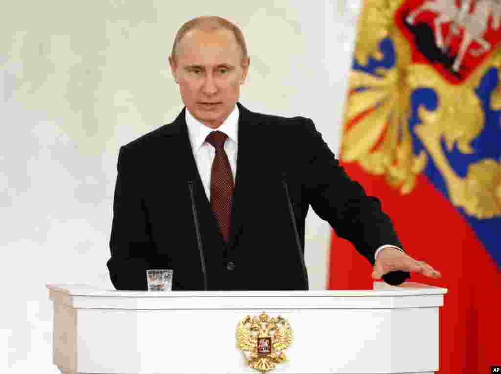 Russia's President Vladimir Putin addresses the Federation Council in Moscow's Kremlin, Russia, March 18, 2014. 