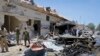 Somali security forces attend the scene of a car bomb attack on a restaurant in Mogadishu, Somalia, April 5, 2017. 