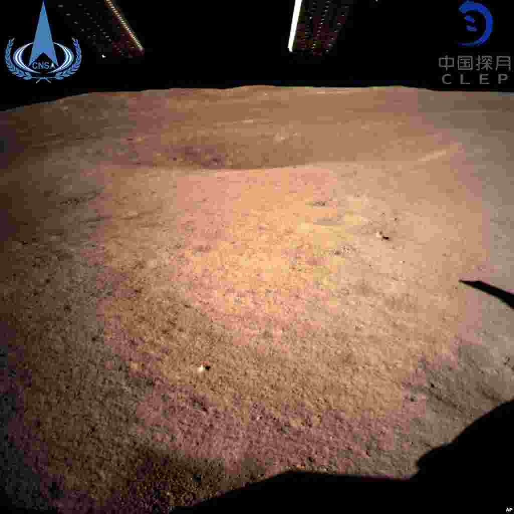 In this photo provided by China National Space Administration via Xinhua News Agency, the first image of the moon's far side taken by China's Chang'e-4 probe. A Chinese spacecraft made the first-ever landing on the far side of the moon, state media said.