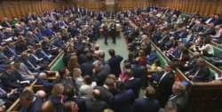 Lawmakers await the result of the vote on The European Union (Withdrawal Agreement) Bill in the House of Commons in London, Dec. 20, 2019.