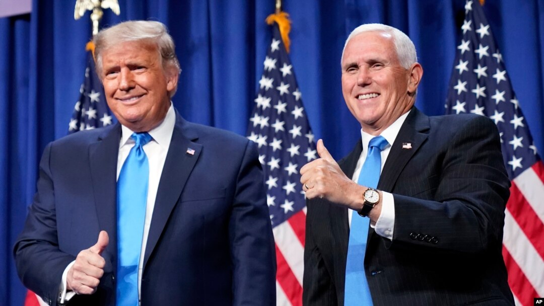 President Donald Trump and Vice President Mike Pence stand on stage during the first day of the 2020 Republican National Convention in Charlotte, N.C., Aug. 24, 2020. 