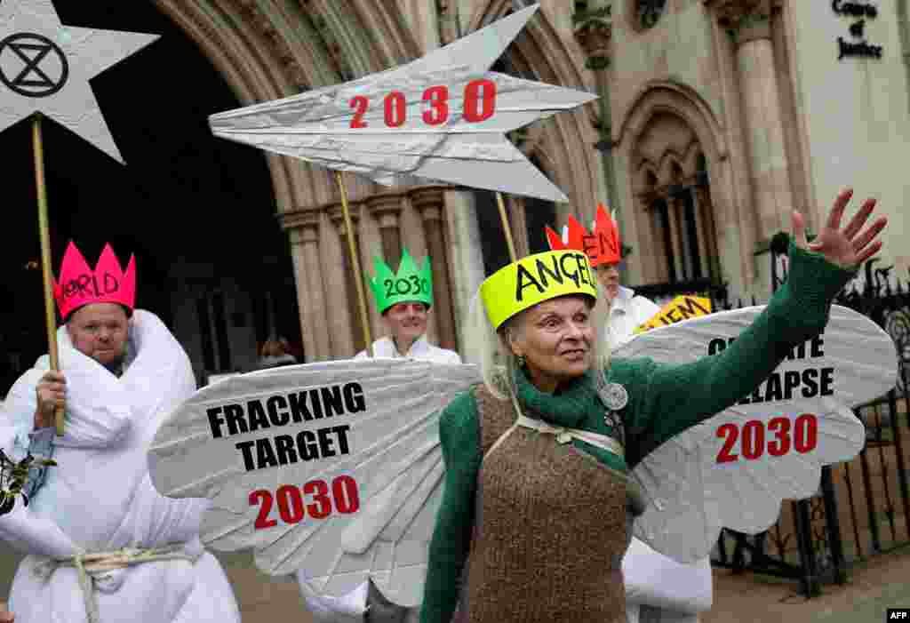 British fashion designer Vivienne Westwood, dressed as an angel, poses with other anti-fracking activists, dressed as Joseph, and the three wise men, as they demonstrate outside the Royal Courts of Justice, Britain's High Court, in central London.
