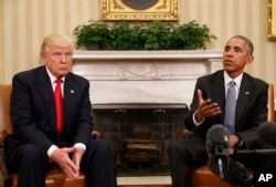 FILE - President Barack Obama meets with President-elect Donald Trump in the Oval Office of the White House.