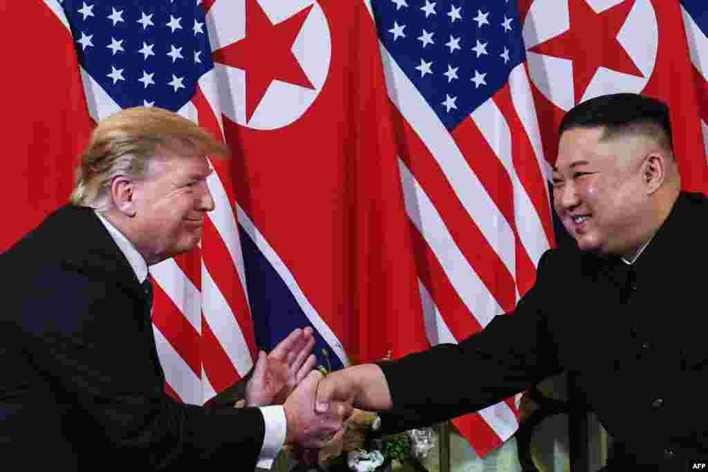 U.S. President Donald Trump (L) shakes hands with North Korean leader Kim Jong Un following a meeting at the Sofitel Legend Metropole hotel in Hanoi, Vietnam.