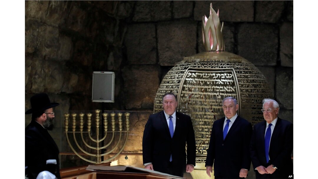 Israeli Prime Minister Benjamin Netanyahu, center, U.S. Secretary of State Mike Pompeo, left, and U.S. Ambassador to Israel David Friedman visit the Western Wall Tunnels in Jerusalem's Old City, March 21, 2019.