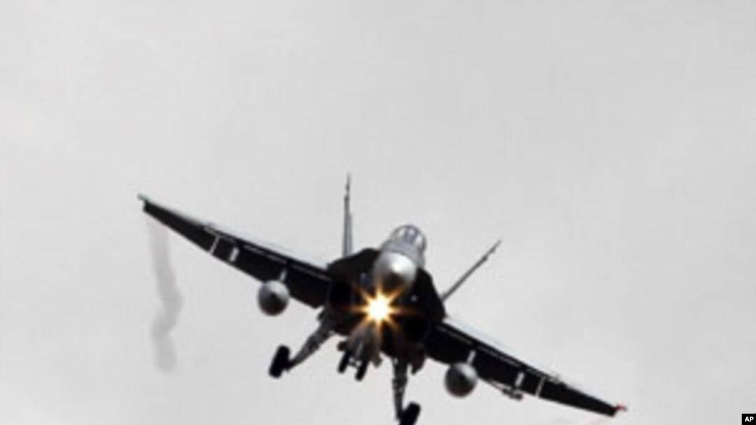 A Canadian CF-18A fighter plane prepares to land at the Birgi NATO Airbase in Trapani in the southern Italian island of Sicily, March 19, 2011