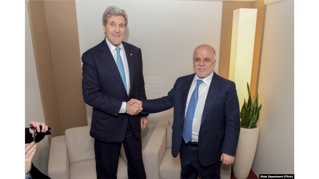 U.S. Secretary of State John Kerry shakes hands with Iraqi Prime Minister Haider al-Abadi before a bilateral meeting amid the World Economic Forum in Davos, Switzerland, Jan. 21, 2016.
