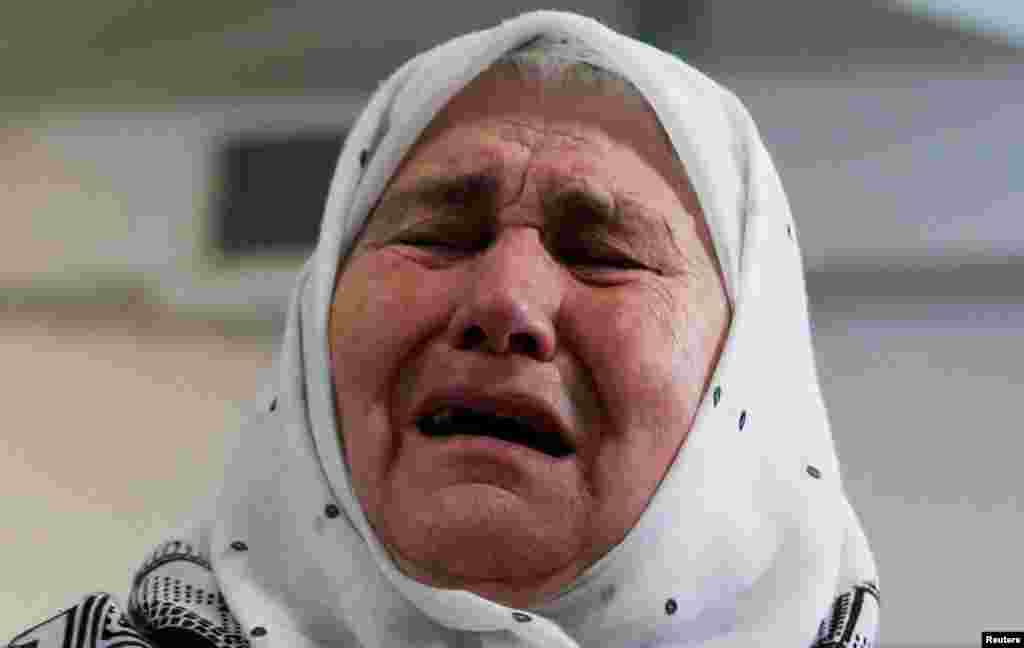 A woman reacts after the verdict on former Bosnian Serb political leader Radovan Karadzic's appeal of his 40-year sentence for war crimes, in the Memorial center Potocari, near Srebrenica, Bosnia and Herzegovina, March 20, 2019.