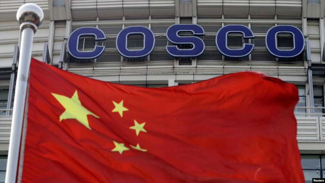 A Chinese national flag flies in front of COSCO's headquarters in Beijing Aug. 26, 2010. 