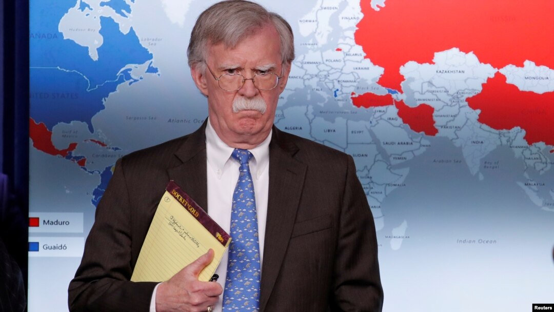 FILE - U.S. National Security Adviser John Bolton arrives to address reporters as the Trump administration announces economic sanctions against Venezuela during a press briefing at the White House in Washington, Jan. 28, 2019.