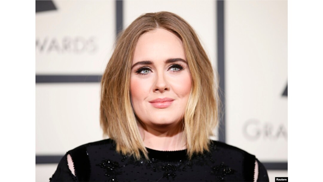 FILE - Singer Adele arrives at the 58th Grammy Awards in Los Angeles, Feb. 15, 2016.