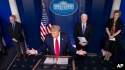 President Donald Trump speaks about the coronavirus accompanied by Dr. Anthony Fauci, left, director of the National Institute of Allergy and Infectious Diseases, Vice President Mike Pence, and Dr. Deborah Birx, White House coronavirus response…