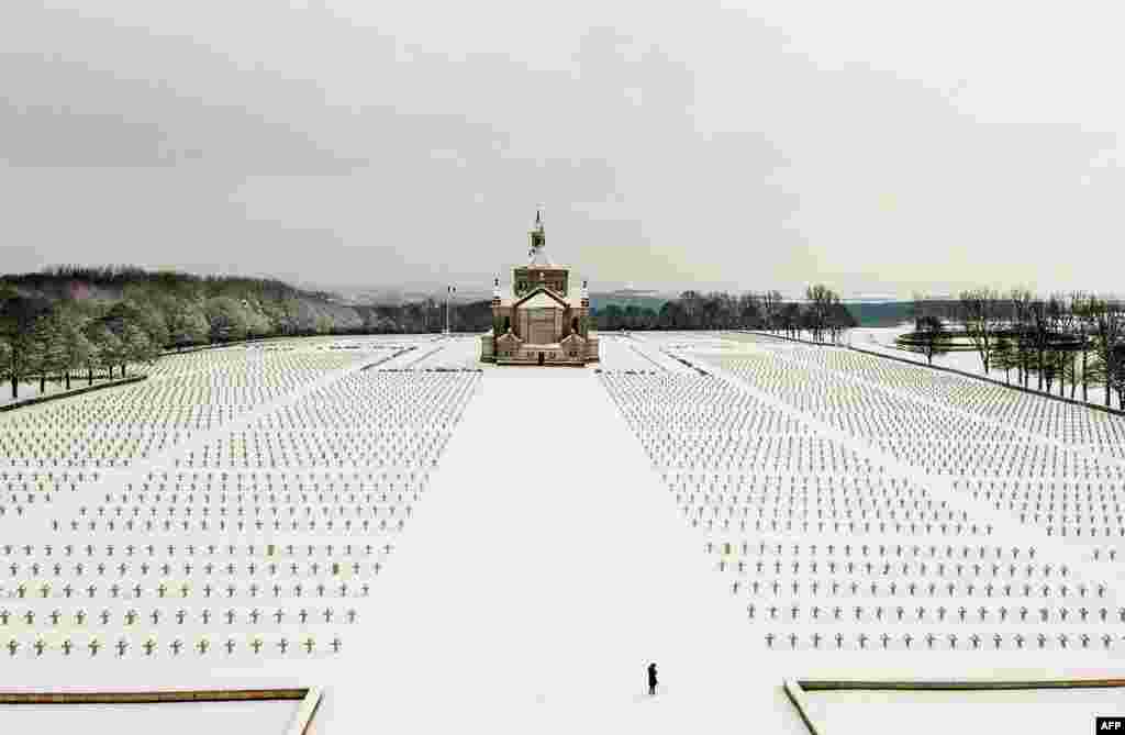 The Notre Dame de Lorette World War I military cemetery in Northern France is seen covered with snow.