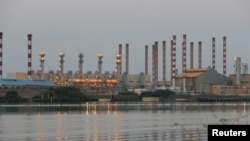 FILE - A general view of Abadan oil refinery in southwest Iran, is pictured from Iraqi side of Shatt al-Arab in Al-Faw south of Basra, Iraq Sept. 21, 2019. 