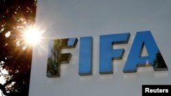 FILE - The logo of FIFA is seen in front of its headquarters in Zurich, Switzerland.