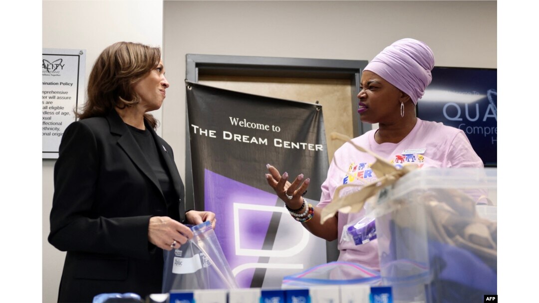 FILE - U.S. Vice President Kamala Harris speaks with a worker on Oct. 5, 2024, as she helps prepare hygiene care packages at a health clinic where the N.C. Counts Coalition nonprofit is preparing then delivering them to victims of Hurricane Helene in Charlotte, North Carolina.