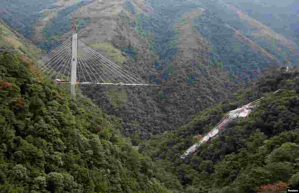 A bridge that is under construction, but that had a span collapse, can be seen in Chirajara, near Bogota, Colombia, Jan. 15, 2018.