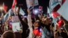 Supporters wave Taiwan's national flags and Taiwan People's Party (TPP) flags during an election campaign rally in Keelung on Jan. 10, 2024.