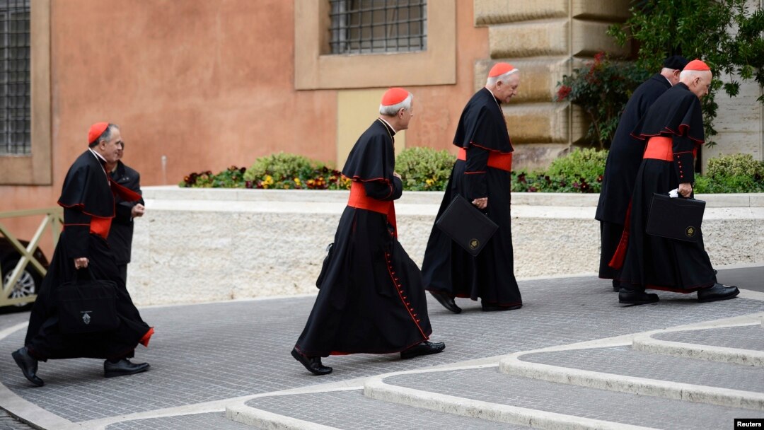 U.S. Cardinals (L-R) Daniel Di Nardo, Donald Wuerl, William Levada, and Francis George arrive for a meeting in the Synod Hall at the Vatican, Mar. 8, 2013.