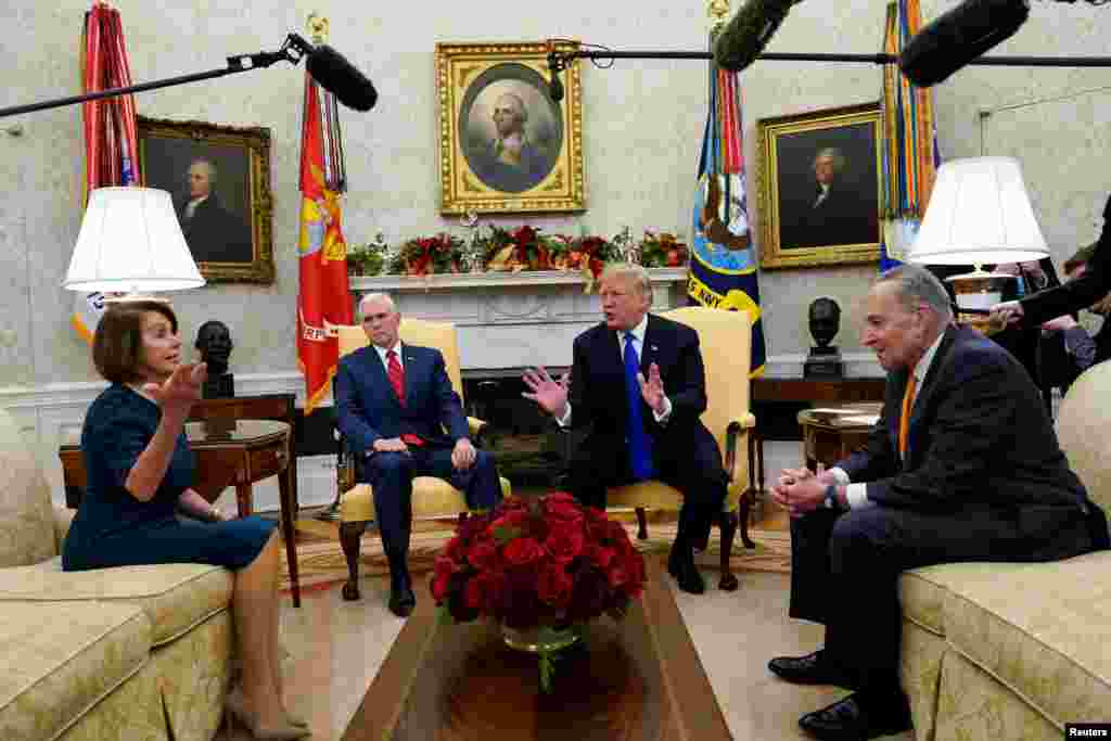 U.S. President Donald Trump, sitting next to Vice President Mike Pence (2ndL) meets with Senate Democratic Leader Chuck Schumer (D-NY) and House Democratic Leader Nancy Pelosi (D-CA) at the White House in Washington.