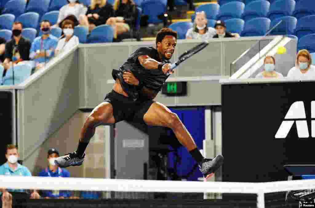 Gael Monfils of France hits a return during his second round match against Kazakhstan's Alexander Bublik on day three of the Australian Open tennis tournament in Melbourne.