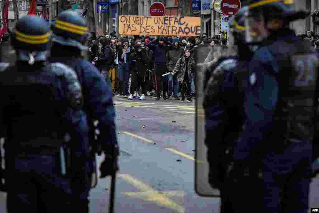 High school students demonstrate in front of riot police in Lyon, France, to protest against the different education reforms including the overhauls and stricter university entrance requirements.