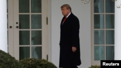 Donald Trump walks to the Oval Office after returning from Mar-A-Lago to the White House