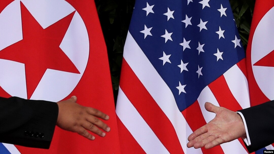 FILE - U.S. President Donald Trump and North Korea's leader Kim Jong Un meet at the start of their summit at the Capella Hotel on the resort island of Sentosa, Singapore, June 12, 2018.